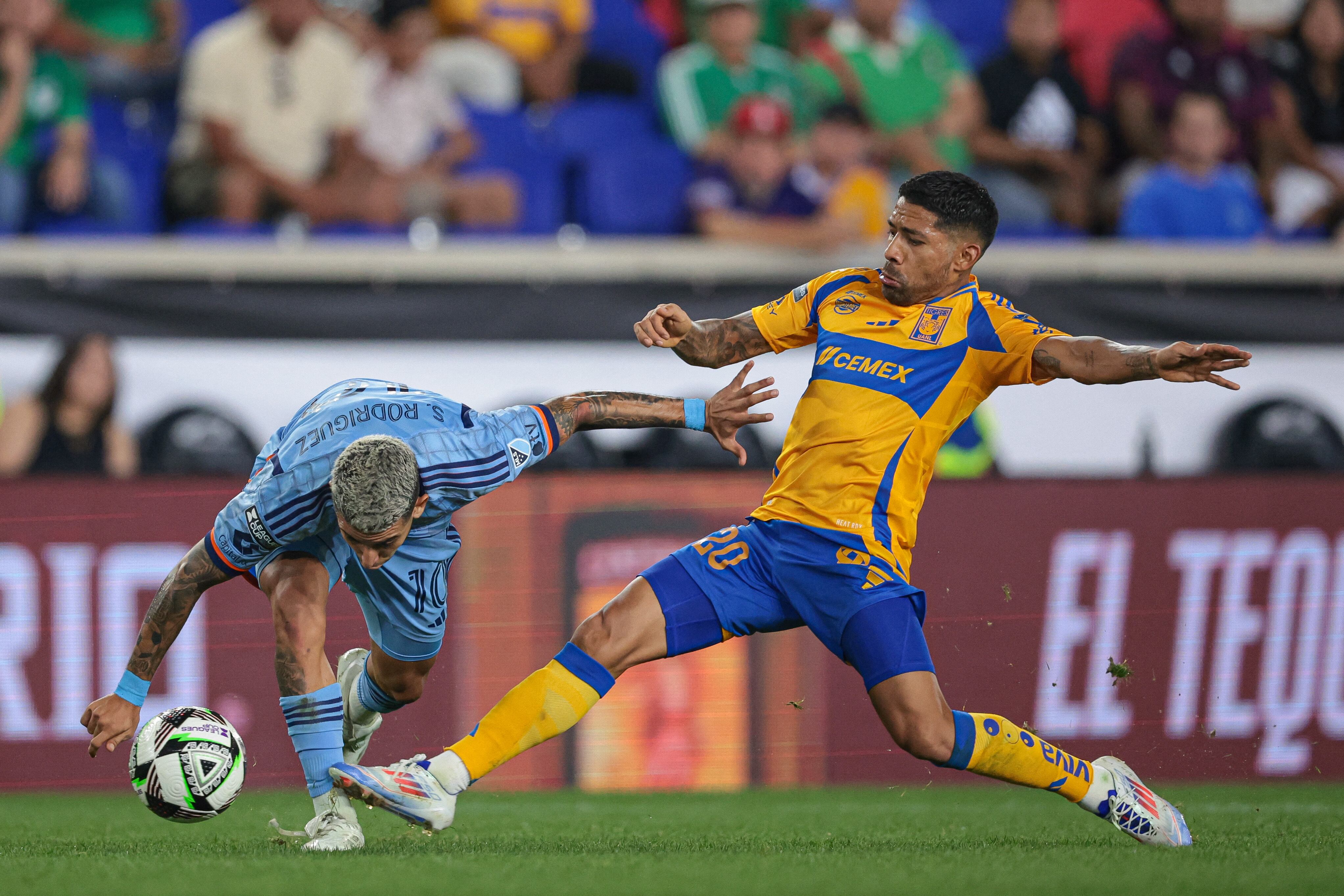 Aug 13, 2024; Harrison, New Jersey, USA; Tigres UANL midfielder Javier Aquino (20) plays the ball against New York City FC forward Santiago Rodriguez (10) during the second half at Red Bull Arena. Mandatory Credit: Vincent Carchietta-USA TODAY Sports