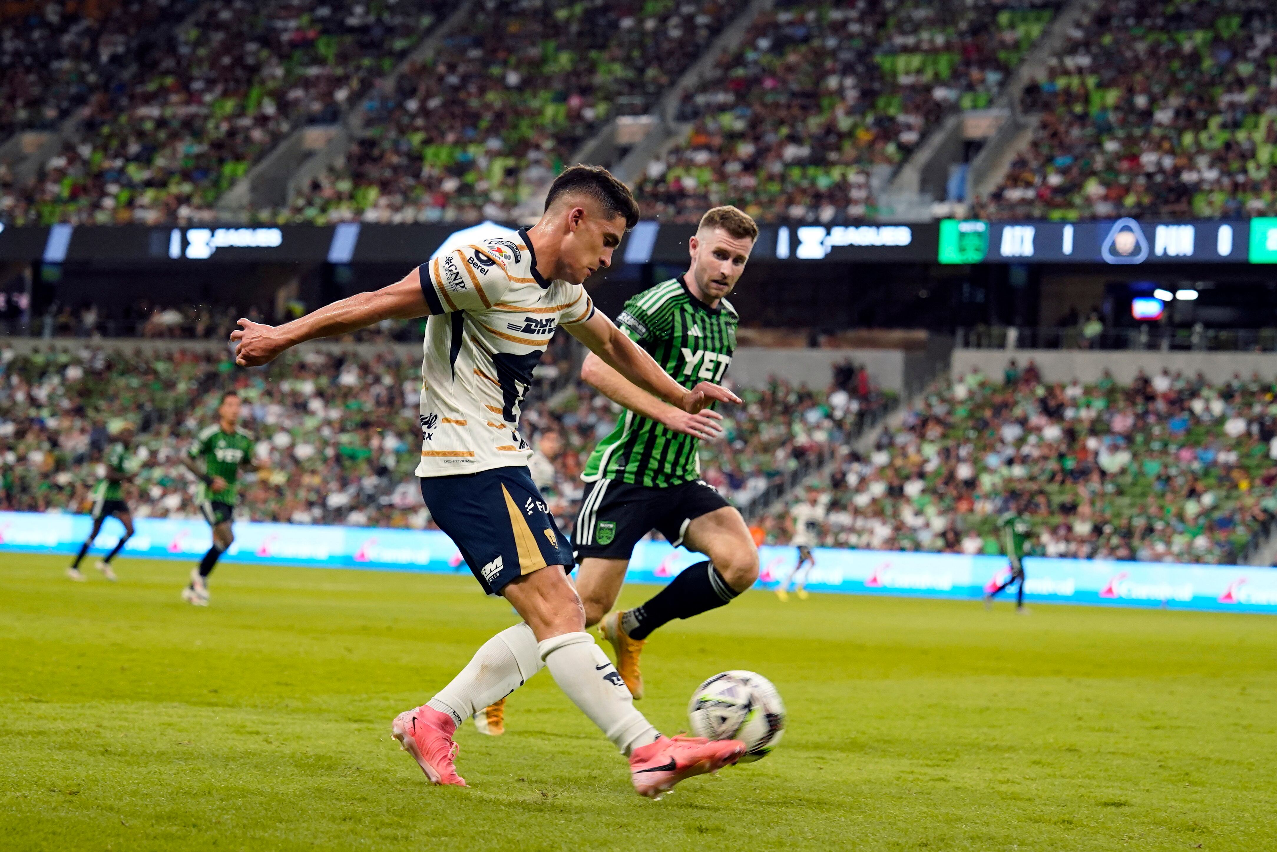 Jul 26, 2024; Austin, Texas, USA; Pumas CU midfielder Rodrigo Lopez (7) passes the ball while defended by Austin FC defender Jon Gallagher (17) during the first half at Q2 Stadium. Mandatory Credit: Scott Wachter-USA TODAY Sports