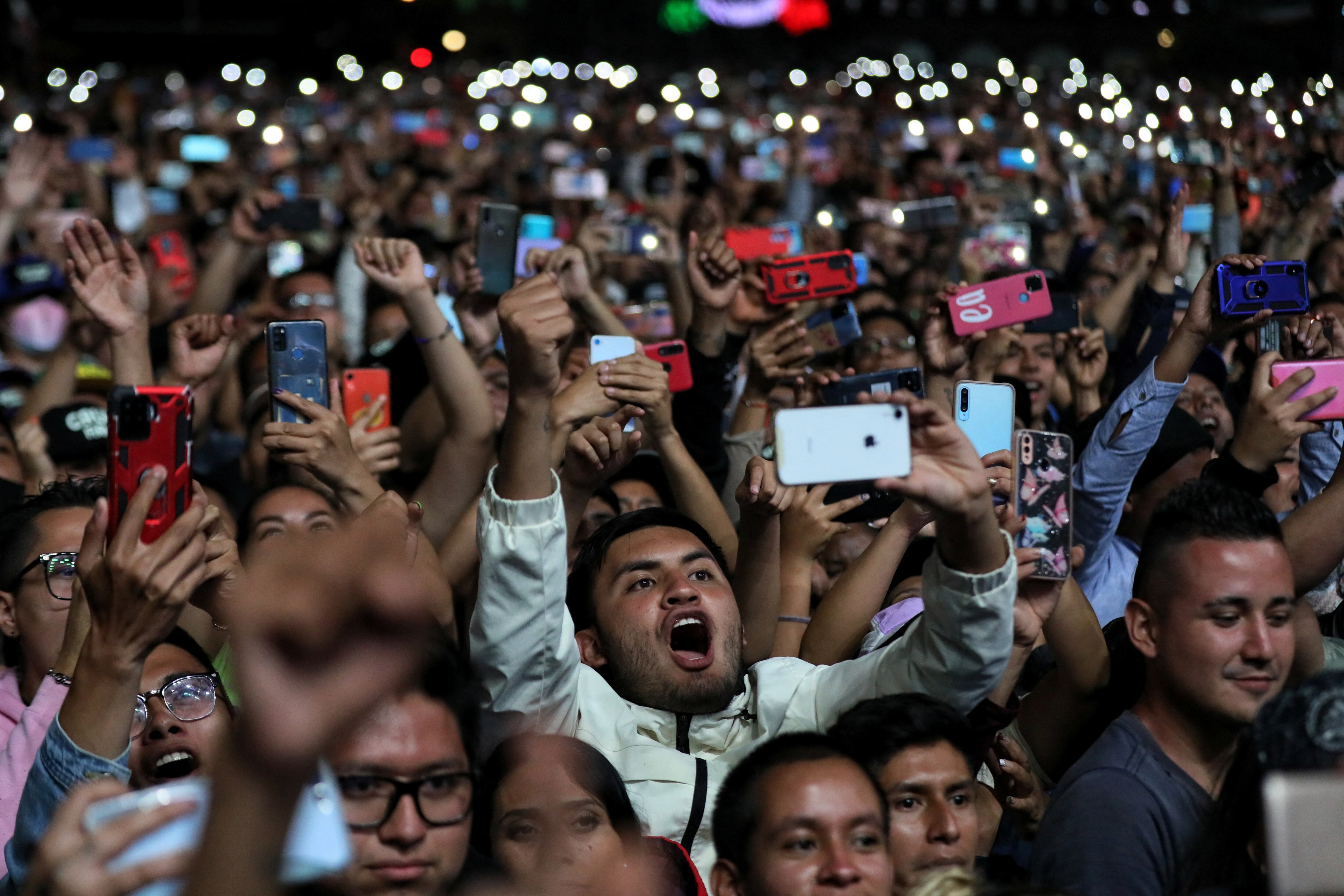 A man reacts during a free concert of Grupo Firme at the Zocalo square, in downtown Mexico City, Mexico September 25, 2022. Mexico City Government/Handout via REUTERS ATTENTION EDITORS - THIS IMAGE HAS BEEN SUPPLIED BY A THIRD PARTY. NO RESALES. NO ARCHIVES