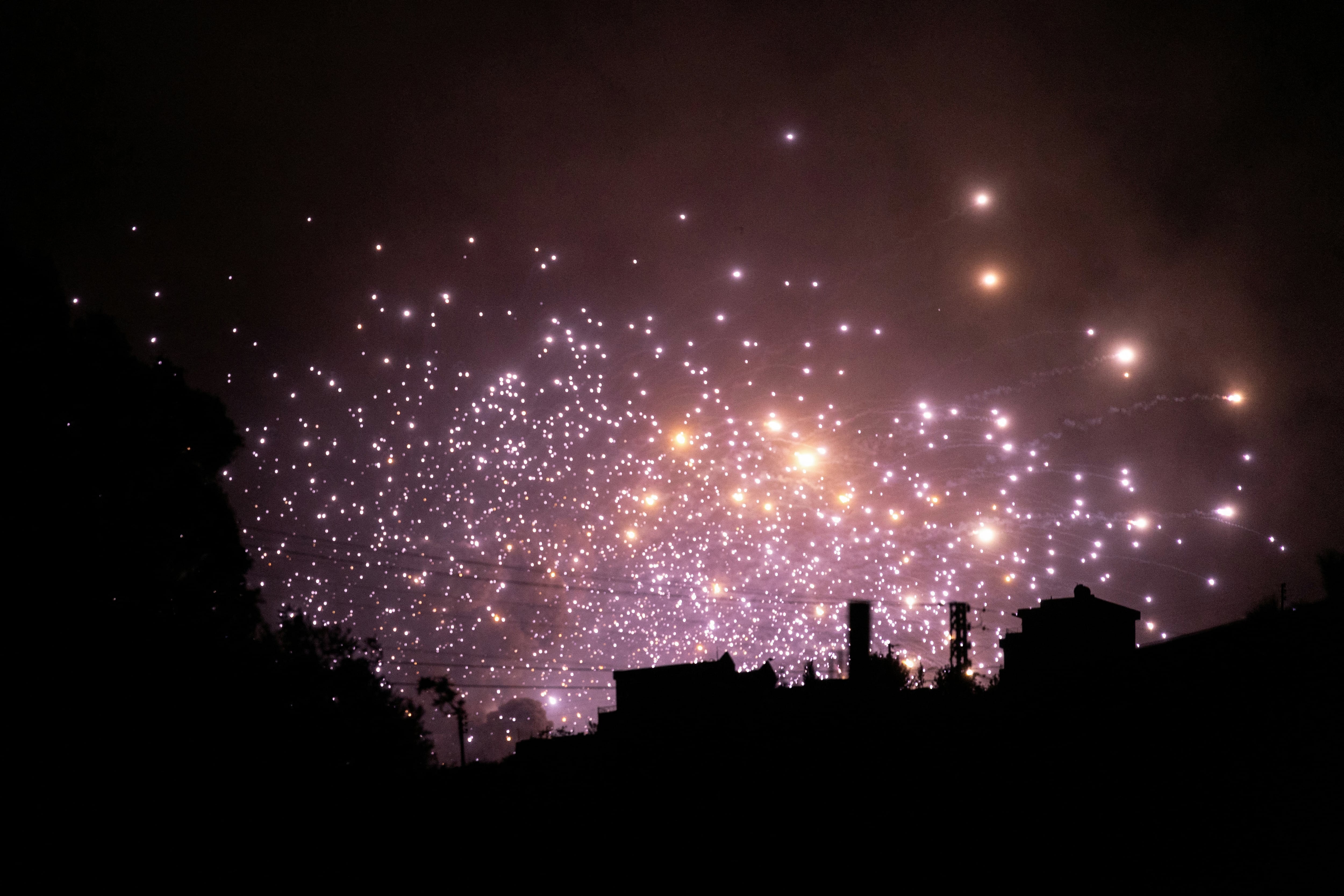 Sparks fly at the site of an Israeli airstrike on the outskirts of the southern Lebanese village of Zawtar on September 21, 2024. Israel's military said it was striking more Hezbollah targets in Lebanon on September 21 evening, after announcing it had hit thousands of rocket launchers and other targets earlier in the day. (Photo by AFP)