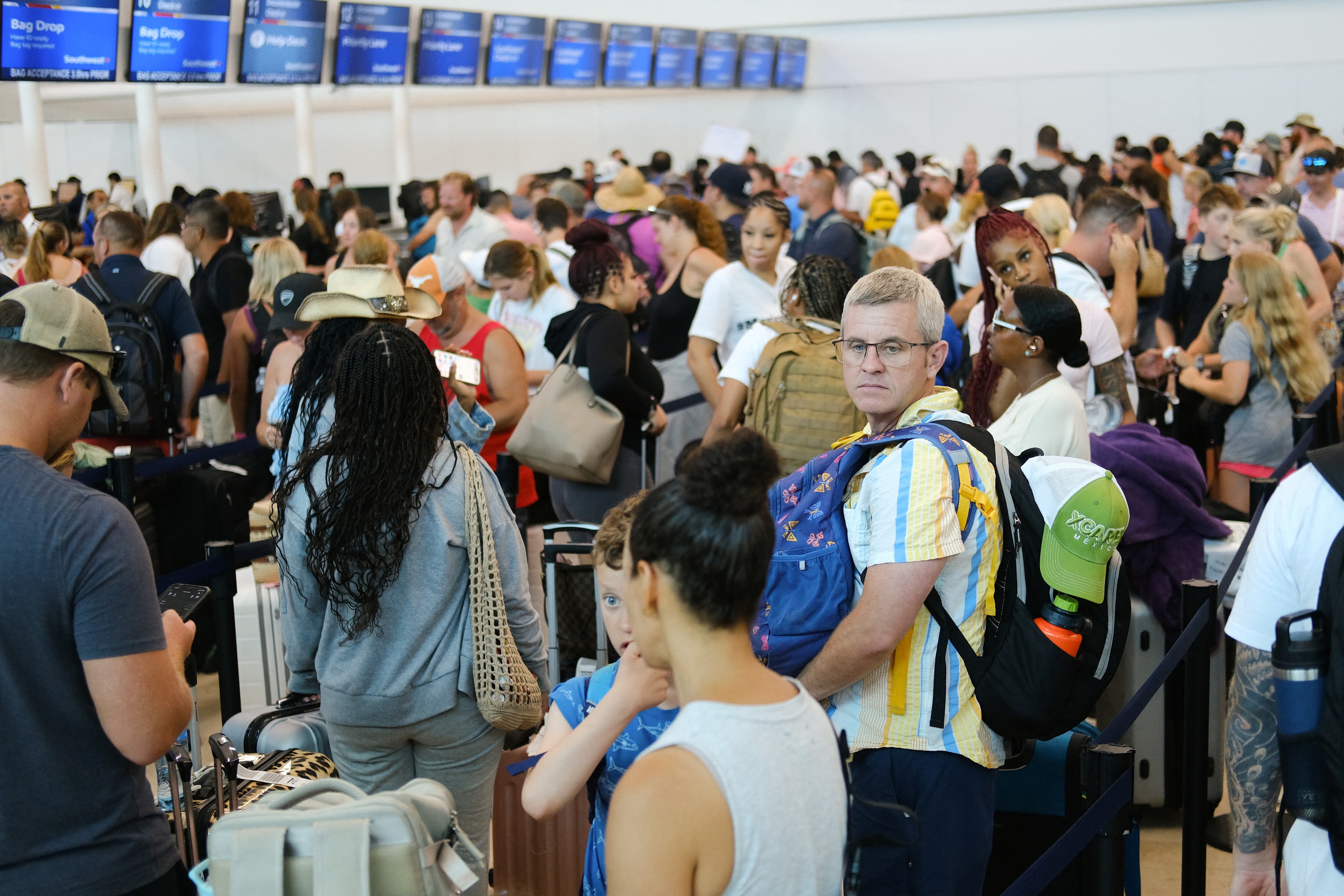 Tourists wait to depart at Cancun International Airport ahead of Hurricane Beryl, in Cancun, Mexico July 4, 2024. REUTERS/Paola Chiomante