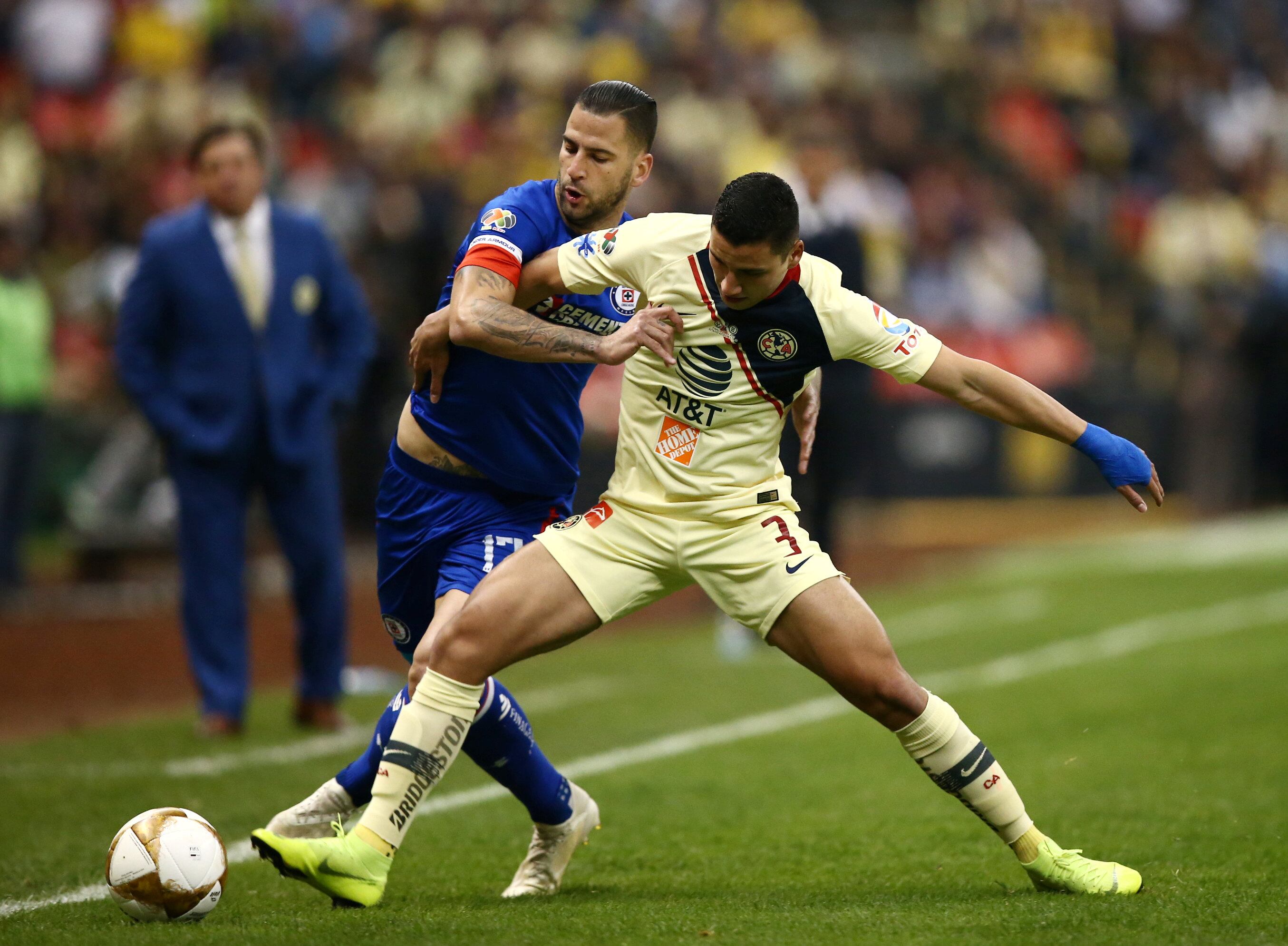 Soccer Football - Liga MX Final First Leg - America v Cruz Azul, Azteca Stadium, Mexico City, Mexico- December 13, 2018   America's Jorge Sanchez in action with Cruz Azul's Edgar Mendez    REUTERS/Edgard Garrido