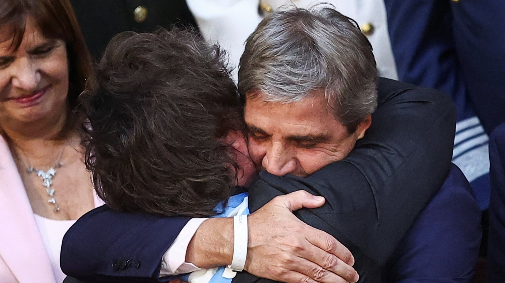 Argentina's President Javier Milei hugs Argentine Economy Minister Luis Caputo during the opening session of the 142nd legislative term, at the National Congress, in Buenos Aires, Argentina, March 1, 2024. REUTERS/Agustin Marcarian