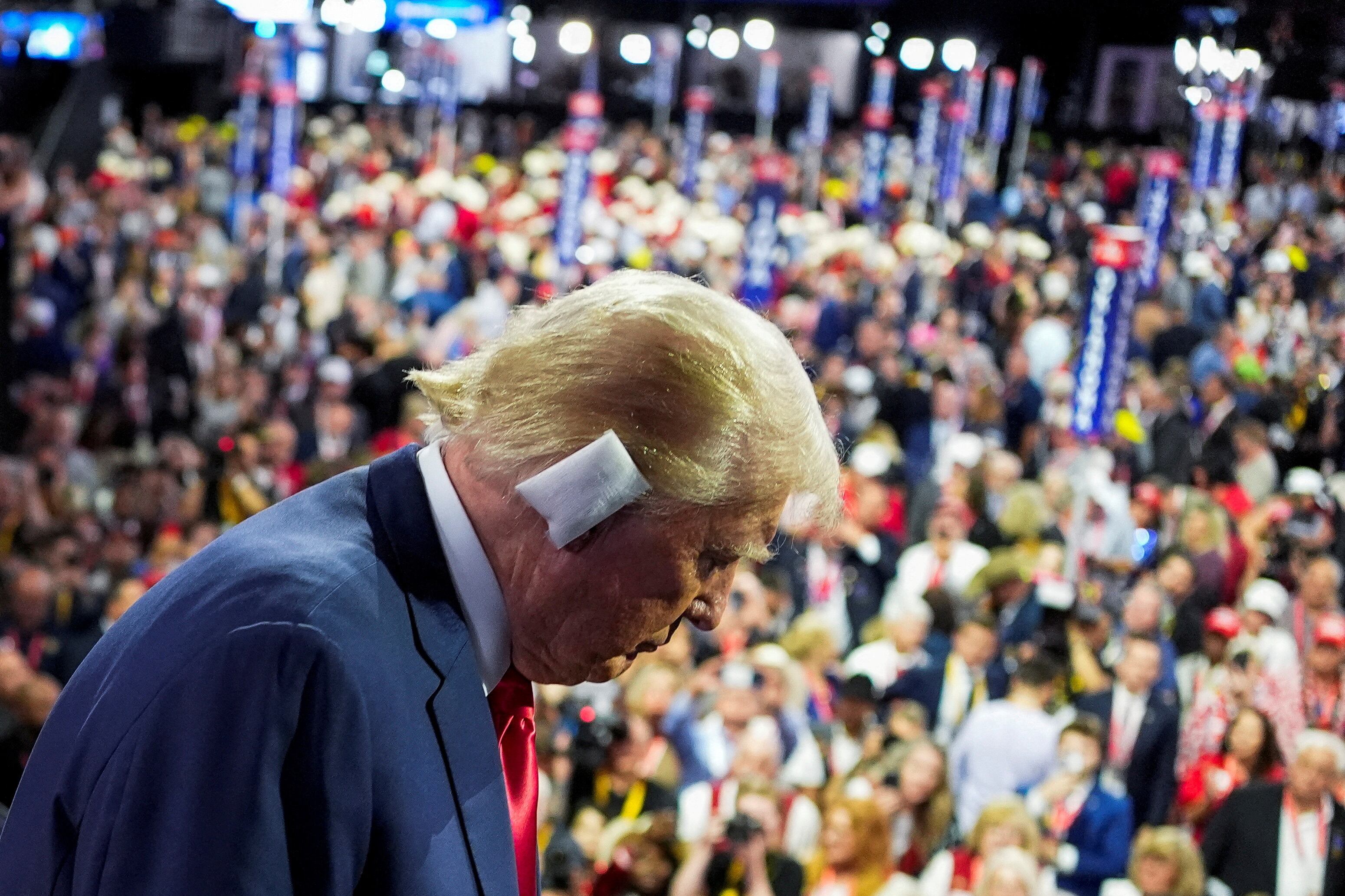 Republican presidential nominee and former U.S. President Donald Trump walks during Day 1 of the Republican National Convention (RNC) at the Fiserv Forum in Milwaukee, Wisconsin, U.S., July 15, 2024. REUTERS/Cheney Orr     TPX IMAGES OF THE DAY