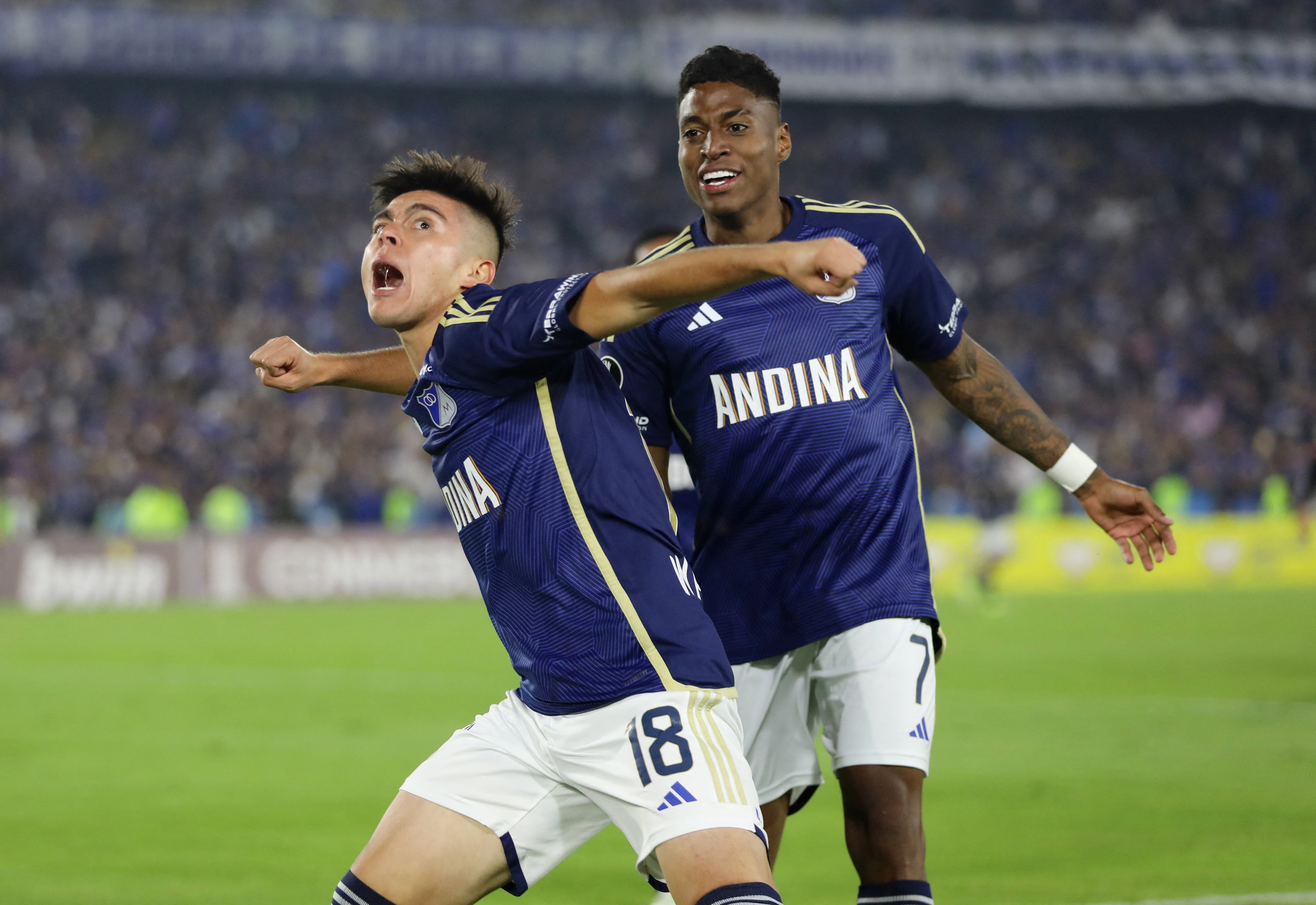 Soccer Football - Copa Libertadores - Group E - Millonarios v Flamengo - Estadio El Campin, Bogota, Colombia - April 2, 2024 Millonarios' Daniel Ruiz celebrates scoring their first goal with Millonarios' Emerson Rodríguez REUTERS/Luisa Gonzalez