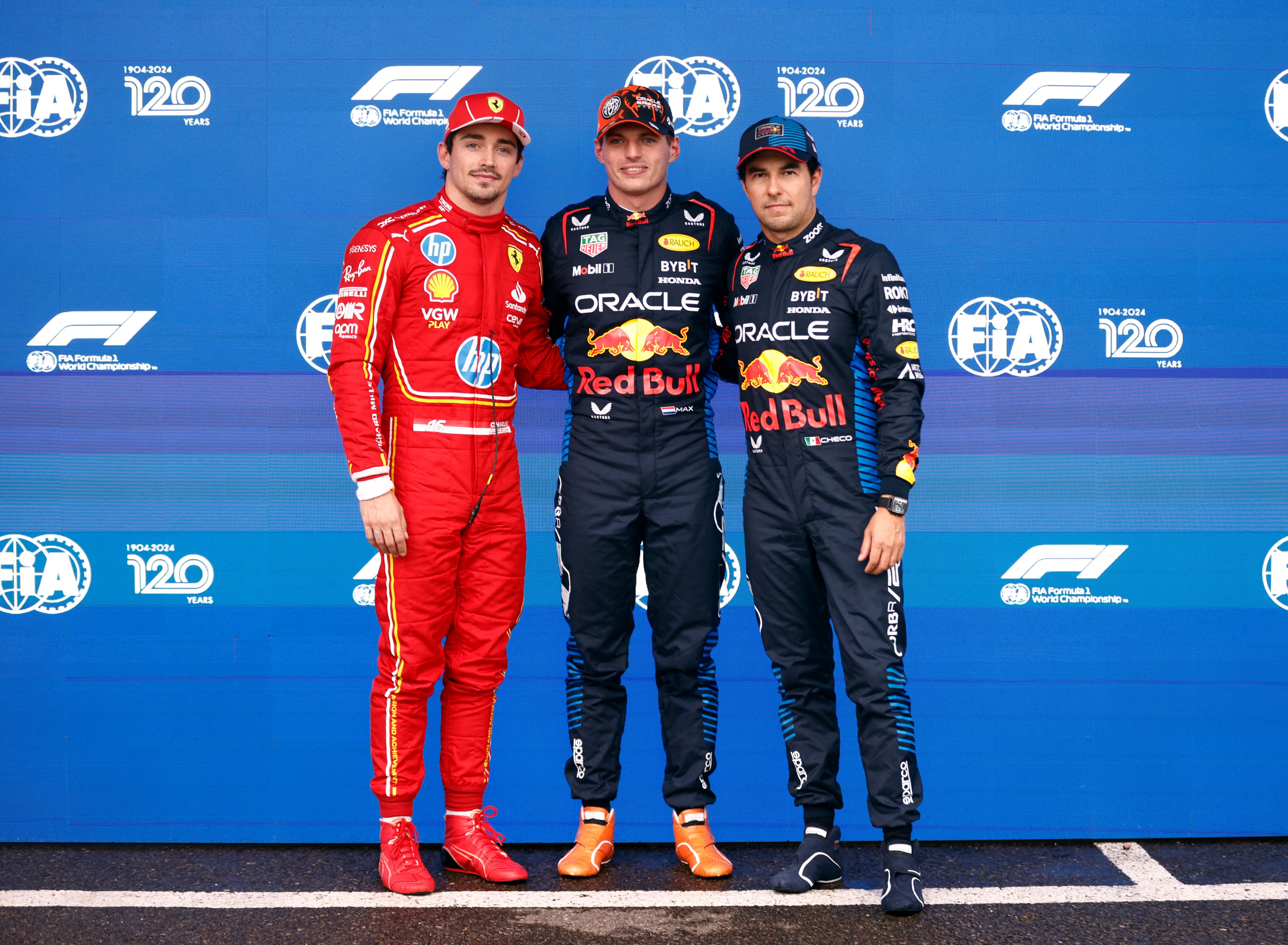 Formula One F1 - Belgian Grand Prix - Circuit de Spa-Francorchamps, Stavelot, Belgium - July 27, 2024 Red Bull's Max Verstappen celebrates with the trophy after qualifying in pole position along with second placed Ferrari's Charles Leclerc and third placed Red Bull's Sergio Perez REUTERS/Johanna Geron