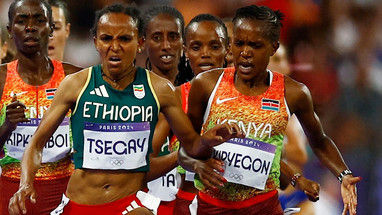 Faith Kipyegon of Kenya clashes with Gudaf Tsegay of Ethiopia