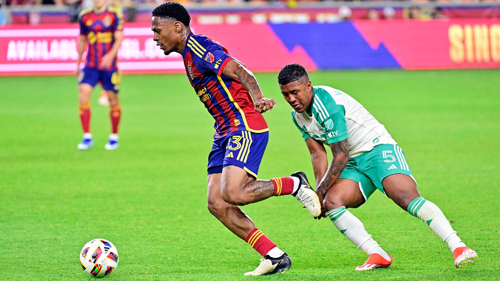 Jun 1, 2024; Sandy, Utah, USA; Real Salt Lake midfielder Nelson Palacio (13) moves the ball against Austin FC midfielder Jhojan Valencia (5) at America First Field. Mandatory Credit: Christopher Creveling-USA TODAY Sports