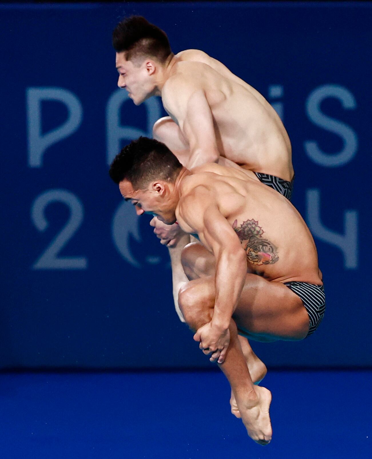 Paris 2024 Olympics - Diving - Men's Synchronised 3m Springboard Final - Aquatics Centre, Saint-Denis, France - August 02, 2024. Juan Manuel Celaya Hernandez of Mexico and Osmar Olvera Ibarra of Mexico in action REUTERS/Gonzalo Fuentes