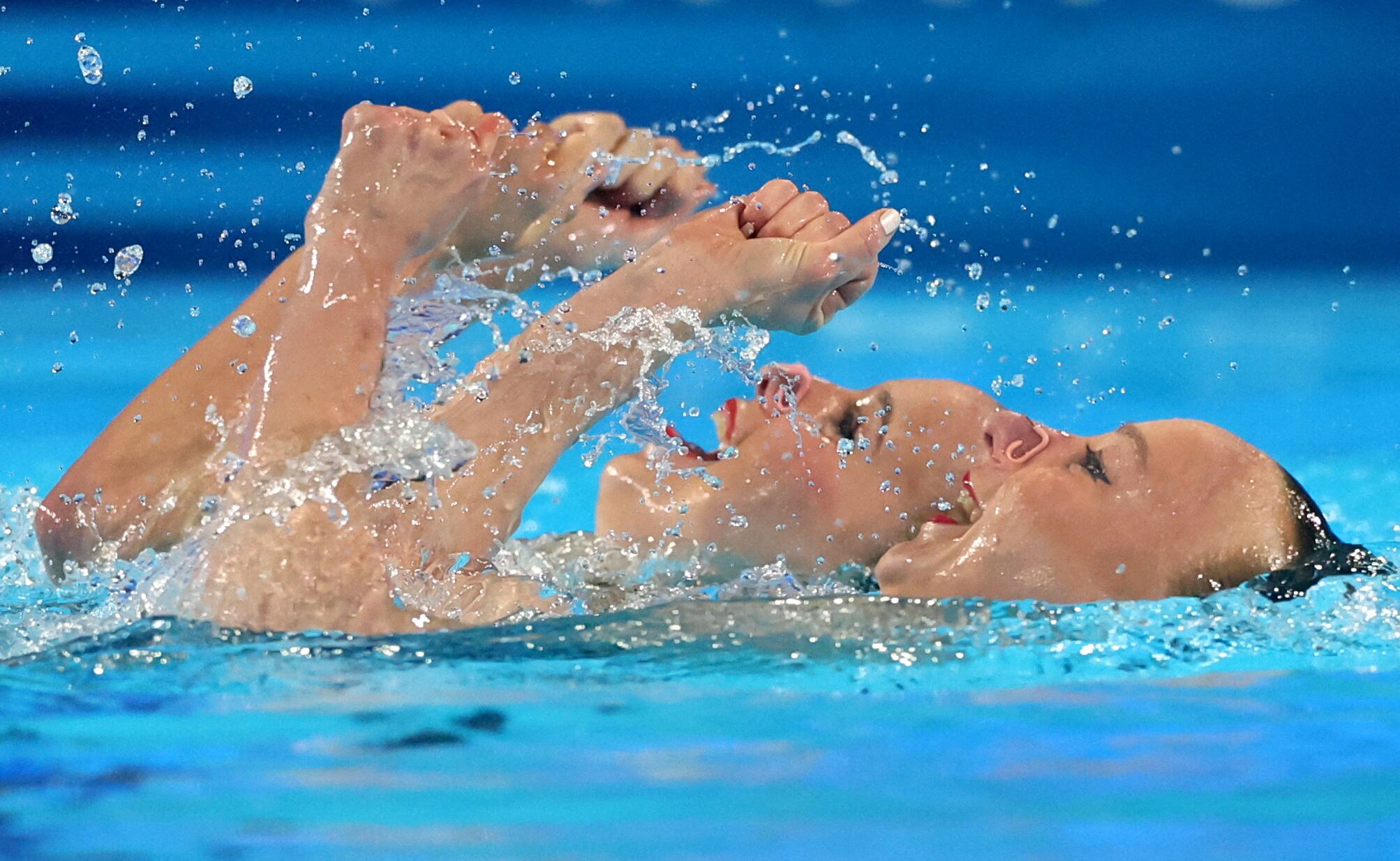 Paris 2024 Olympics - Artistic Swimming - Duet Technical Routine - Aquatics Centre, Saint-Denis, France - August 09, 2024. Anastasia Bayandina and Romane Lunel of France perform. REUTERS/Maye-E Wong