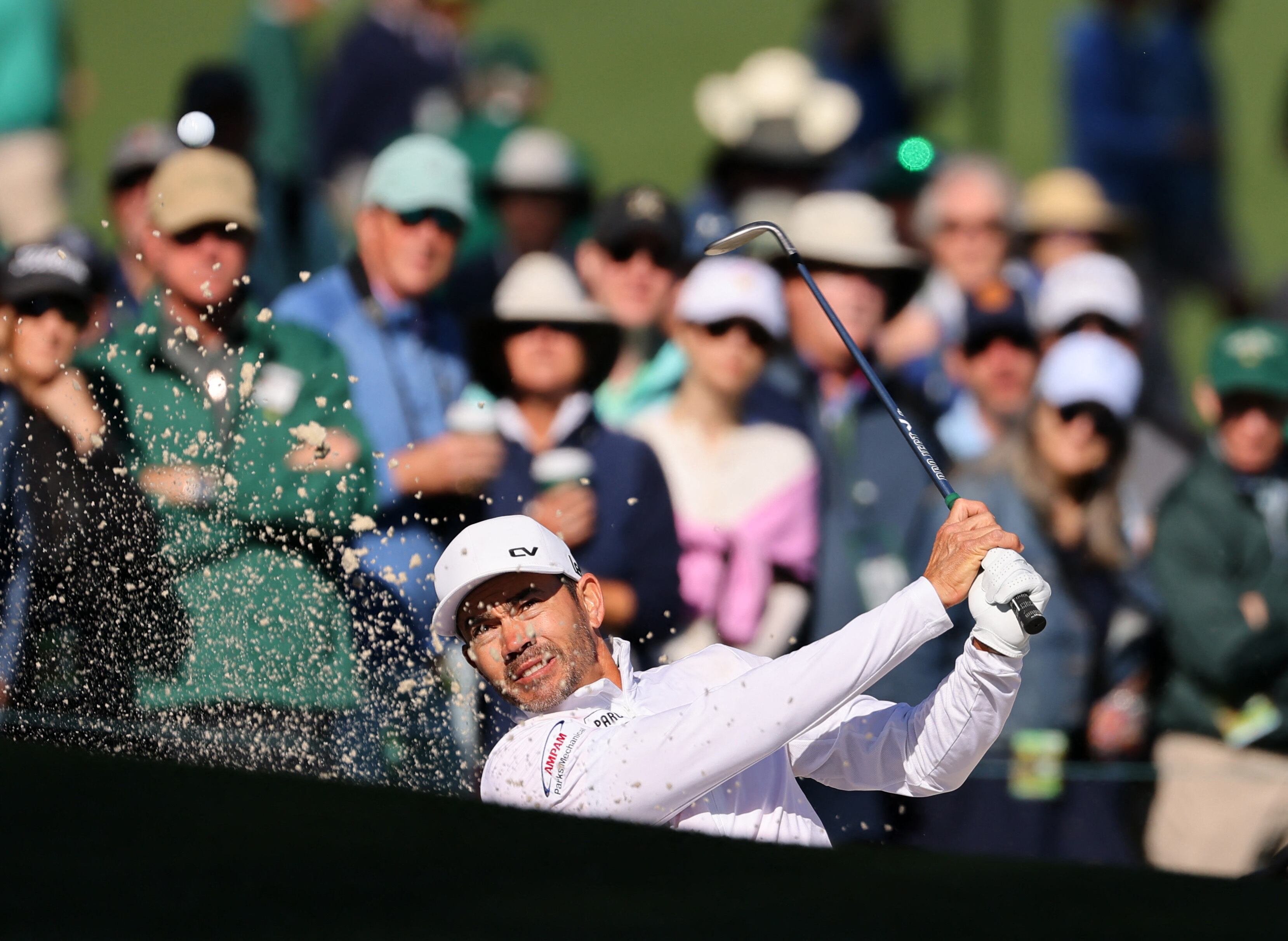 Golf - The Masters - Augusta National Golf Club, Augusta, Georgia, U.S. - April 12, 2024 Colombia's Camilo Villegas plays out from the bunker on the 7th hole during the second round REUTERS/Mike Blake