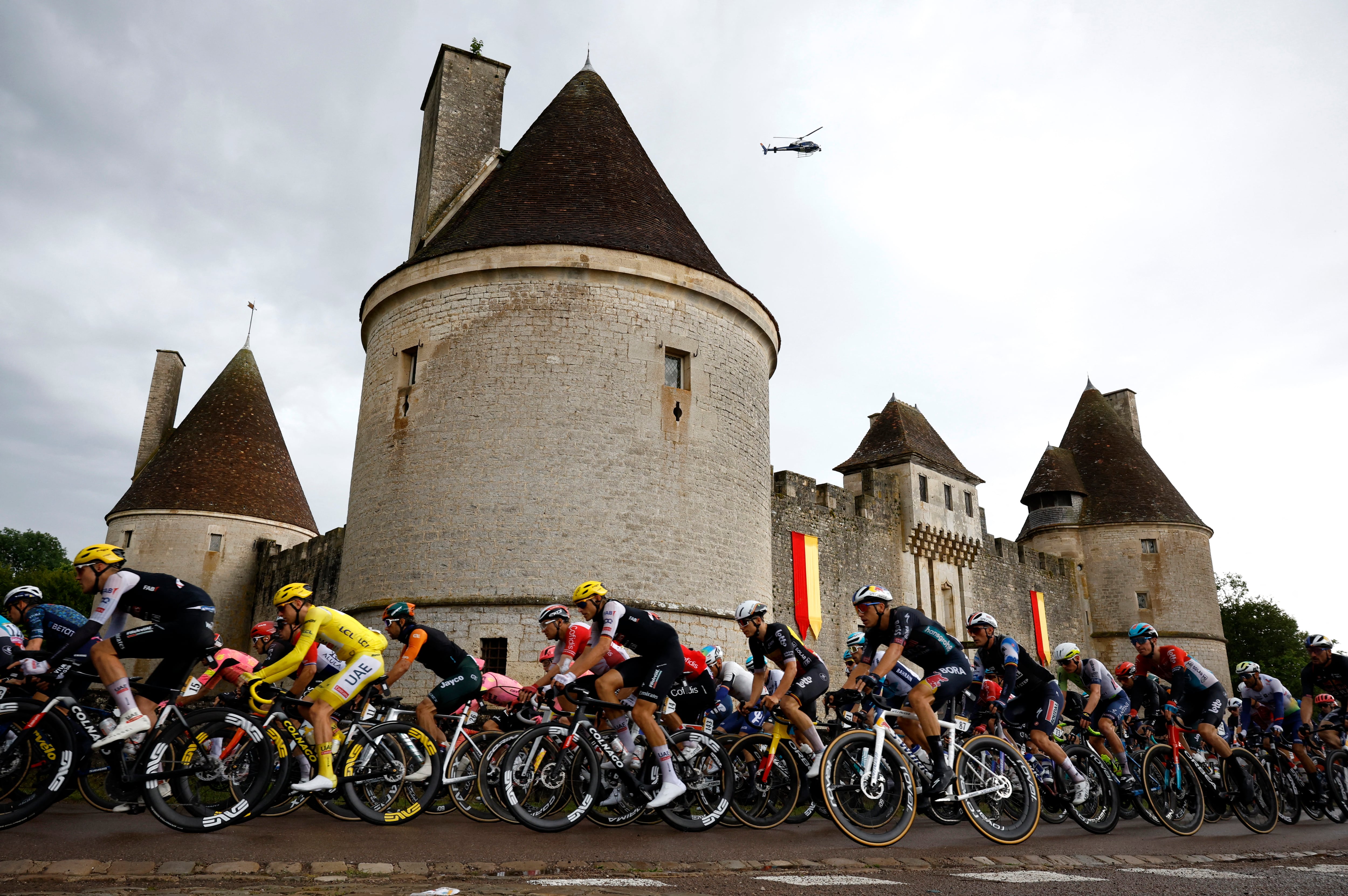 Cycling - Tour de France - Stage 8 - Semur-en-Auxois to Colombey-les-Deux-Eglises - Semur-en-Auxois, France - July 6, 2024 General view of UAE Team Emirates' Tadej Pogacar wearing the yellow jersey in action in the peloton during stage 8 REUTERS/Stephane Mahe