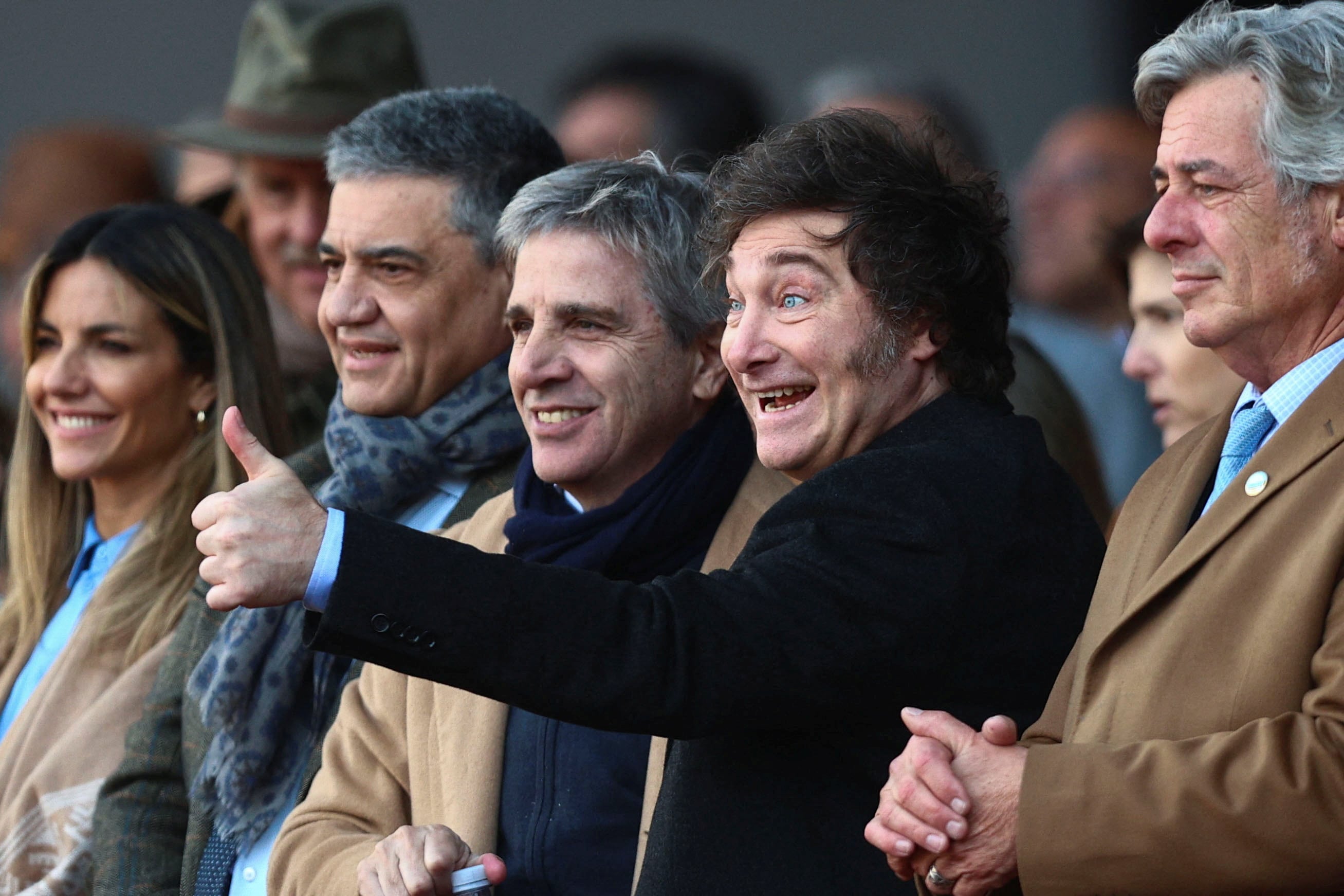 Jorge Macri, Luis Caputo y Javier Milei en la Expo Rural (REUTERS/Matias Baglietto)