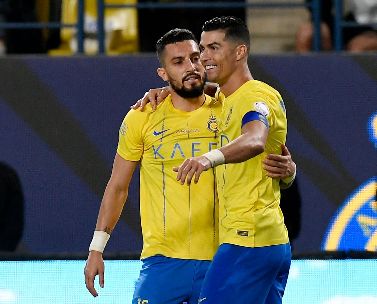 Telles y Cristiano Ronaldo.  (REUTERS/Stringer)