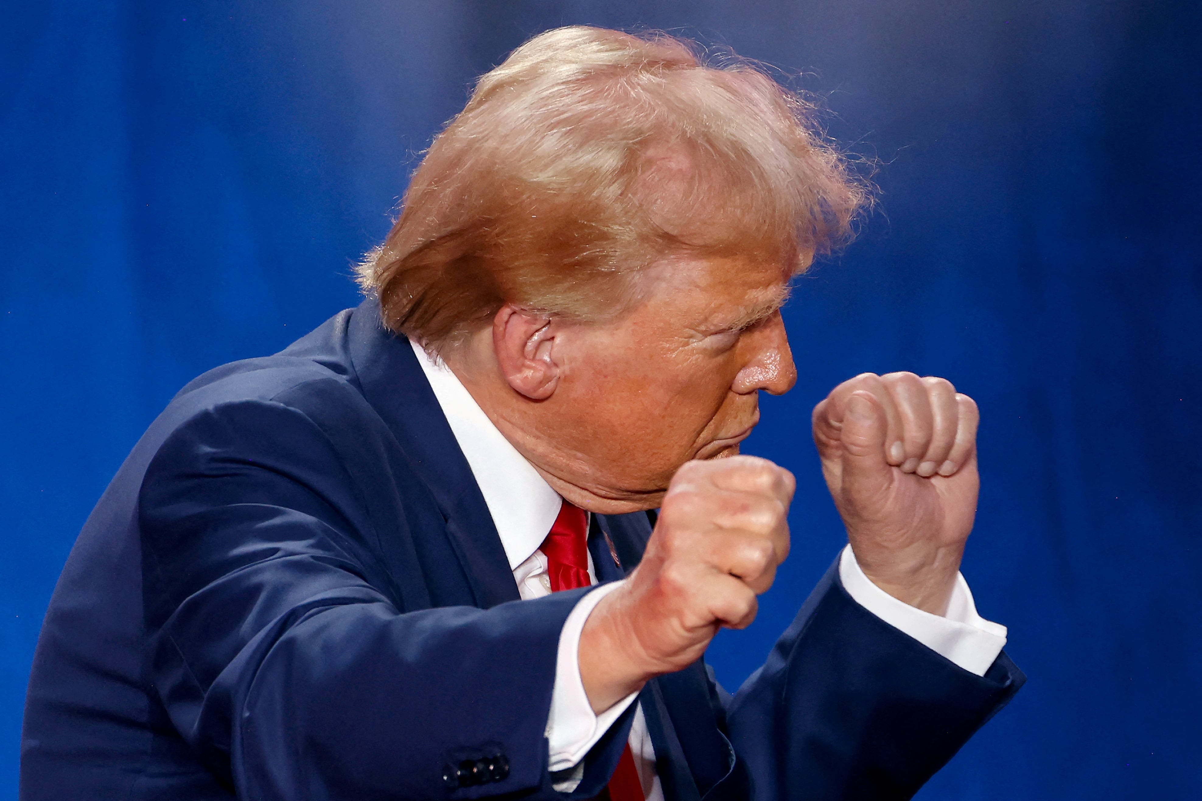 Republican presidential nominee and former U.S. President Donald Trump gestures at the end of a town hall as he campaigns in Fayetteville, North Carolina, U.S. October 4, 2024.  REUTERS/Jonathan Drake     TPX IMAGES OF THE DAY