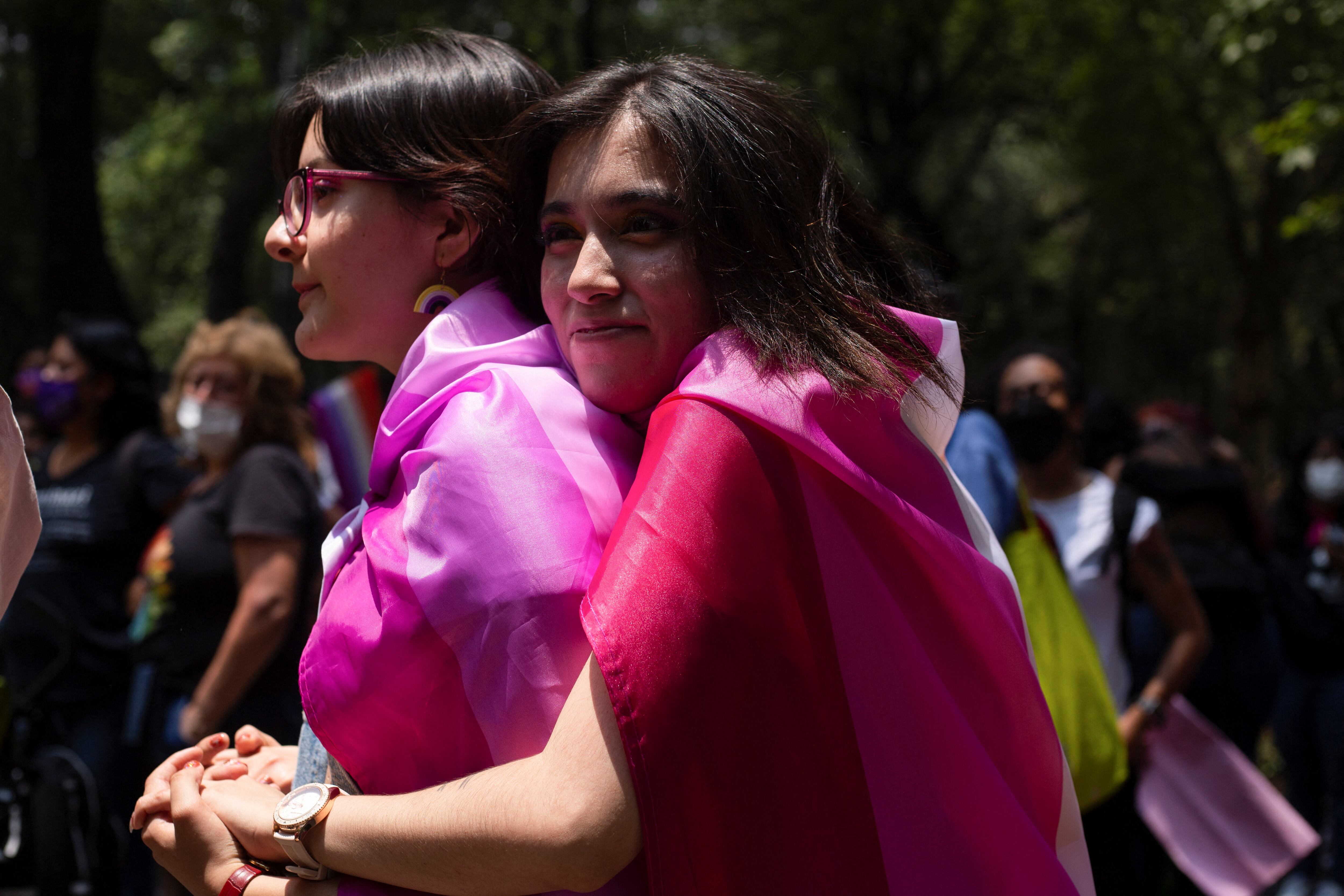 Demonstrators embrace each other during an LGBT protest named "Marcha Lencha 2022" against gender violence and to demand respect for their human rights, in Mexico City, Mexico June 18, 2022. REUTERS/Quetzalli Nicte-Ha