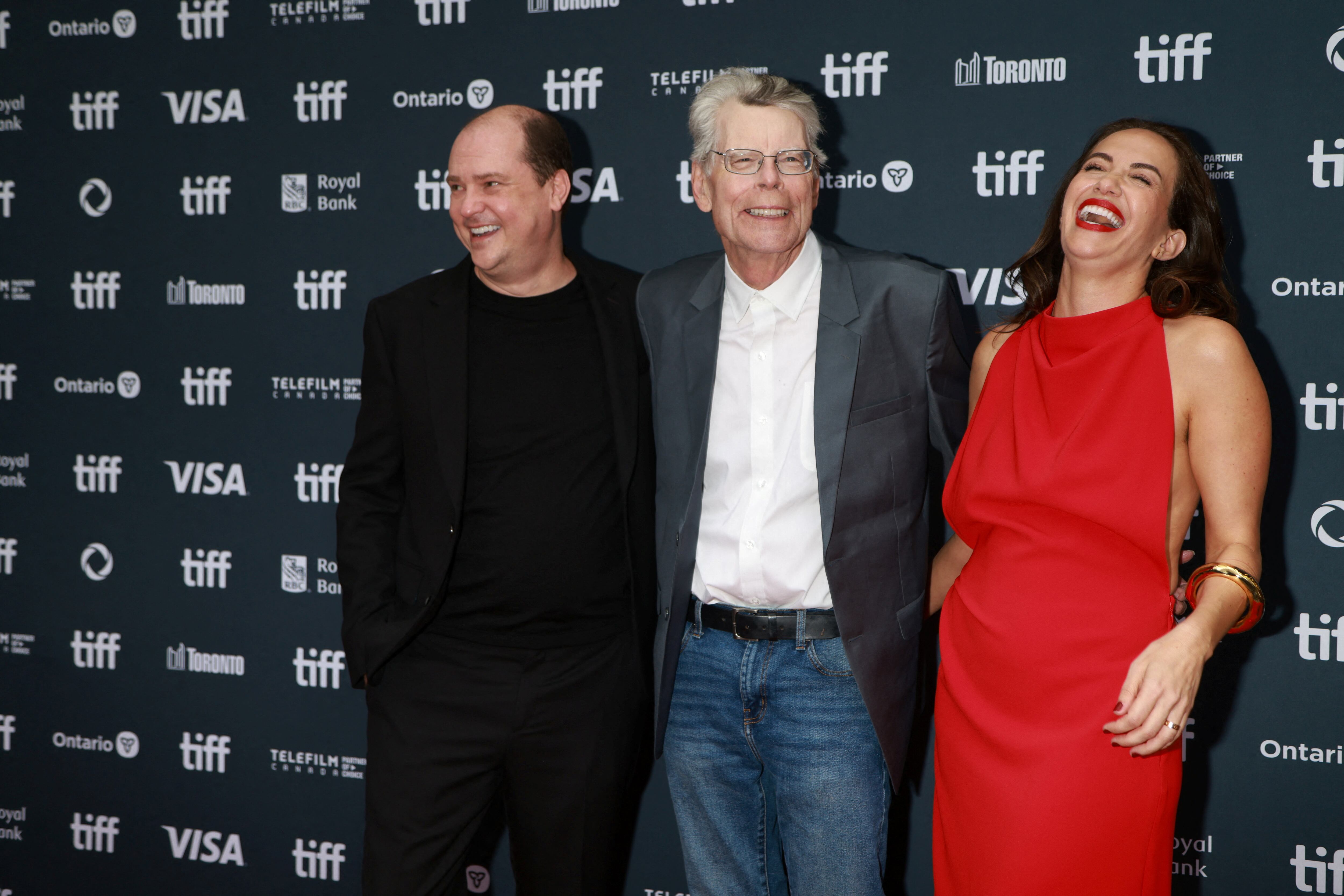 Director Mike Flanagan, Stephen King and cast member Kate Siegel pose on the red carpet before "The Life of Chuck" is screened, as the Toronto International Film Festival (TIFF) returns for its 49th edition in Toronto, Ontario, Canada, September 6, 2024. REUTERS/Carlos Osorio