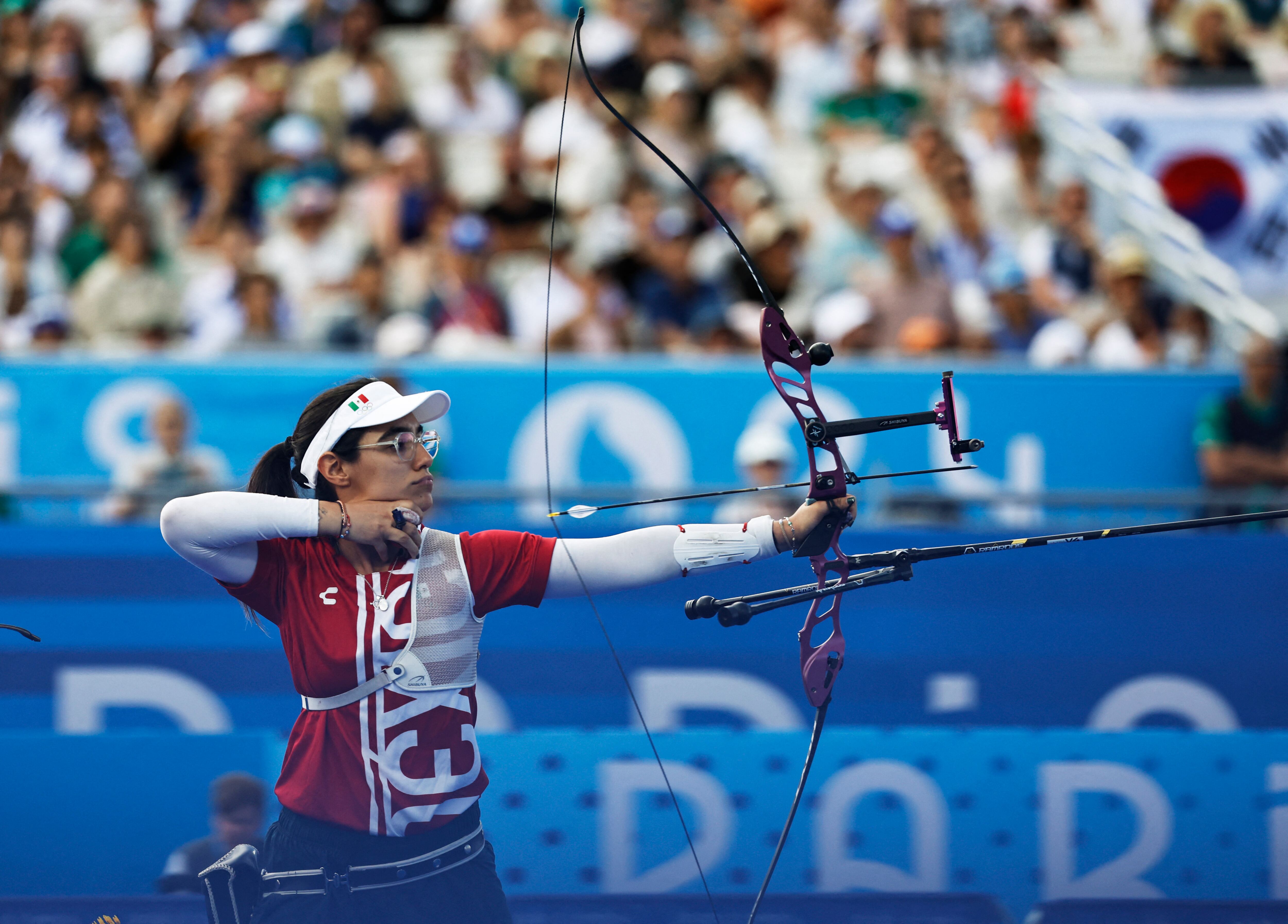 México se cuelga su cuarta medalla en la historia del tiro con arco: 3 bronces y 1 plata. (REUTERS/Tingshu Wang)