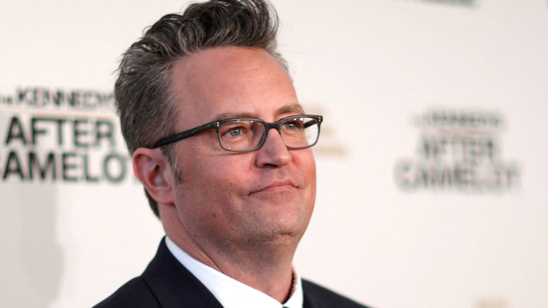 Matthew Perry poses at the premiere for the television series "The Kennedys After Camelot