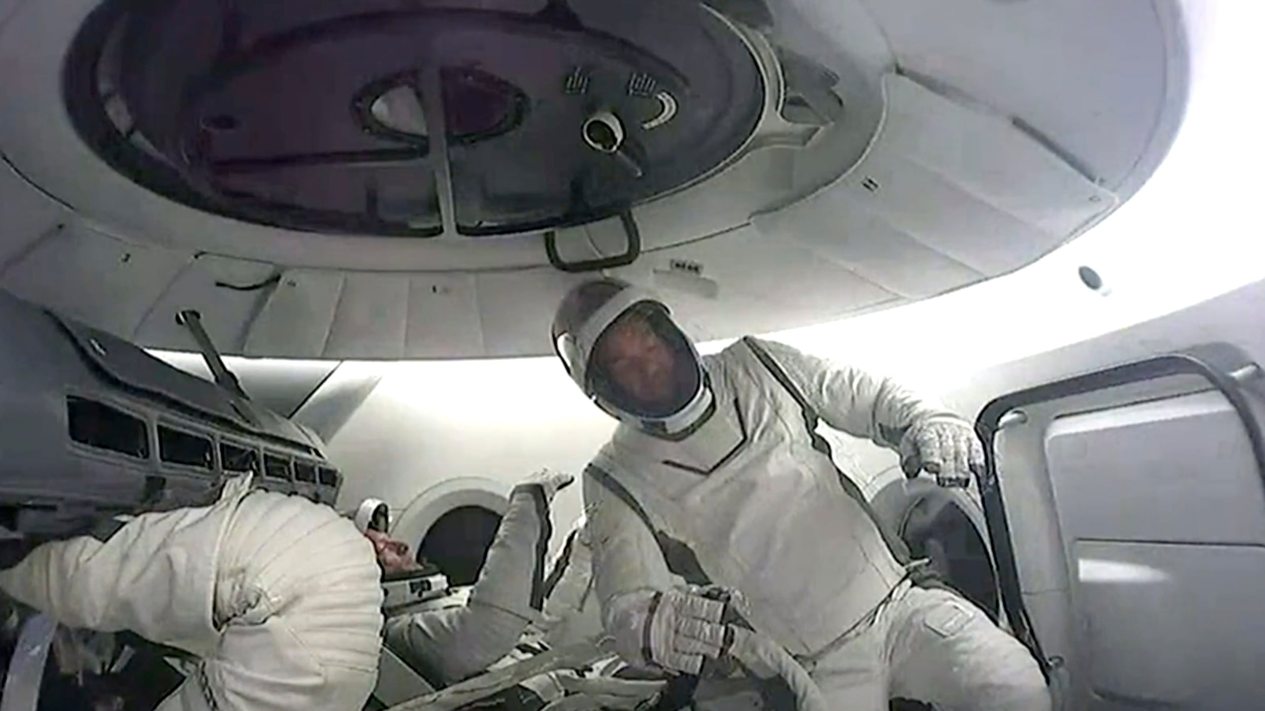 This image made from a SpaceX video shows the crew of the first private spacewalk led by tech billionaire Jared Isaacman inside the capsule, Thursday Sept. 12, 2024. (SpaceX via AP)