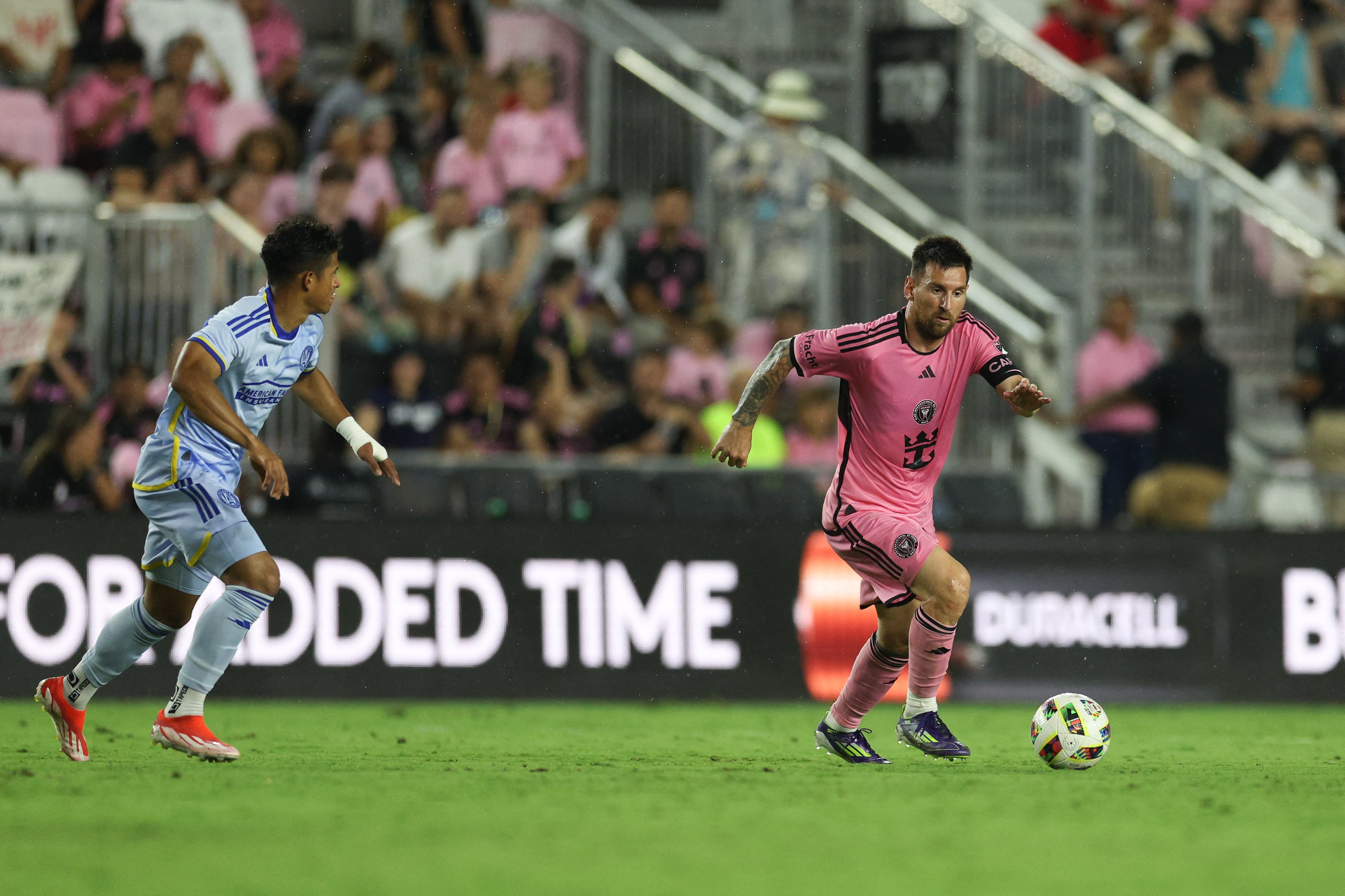 May 29, 2024; Fort Lauderdale, Florida, USA; Inter Miami CF forward Lionel Messi (10) dribbles against Atlanta United during the second half at Chase Stadium. Mandatory Credit: Nathan Ray Seebeck-USA TODAY Sports