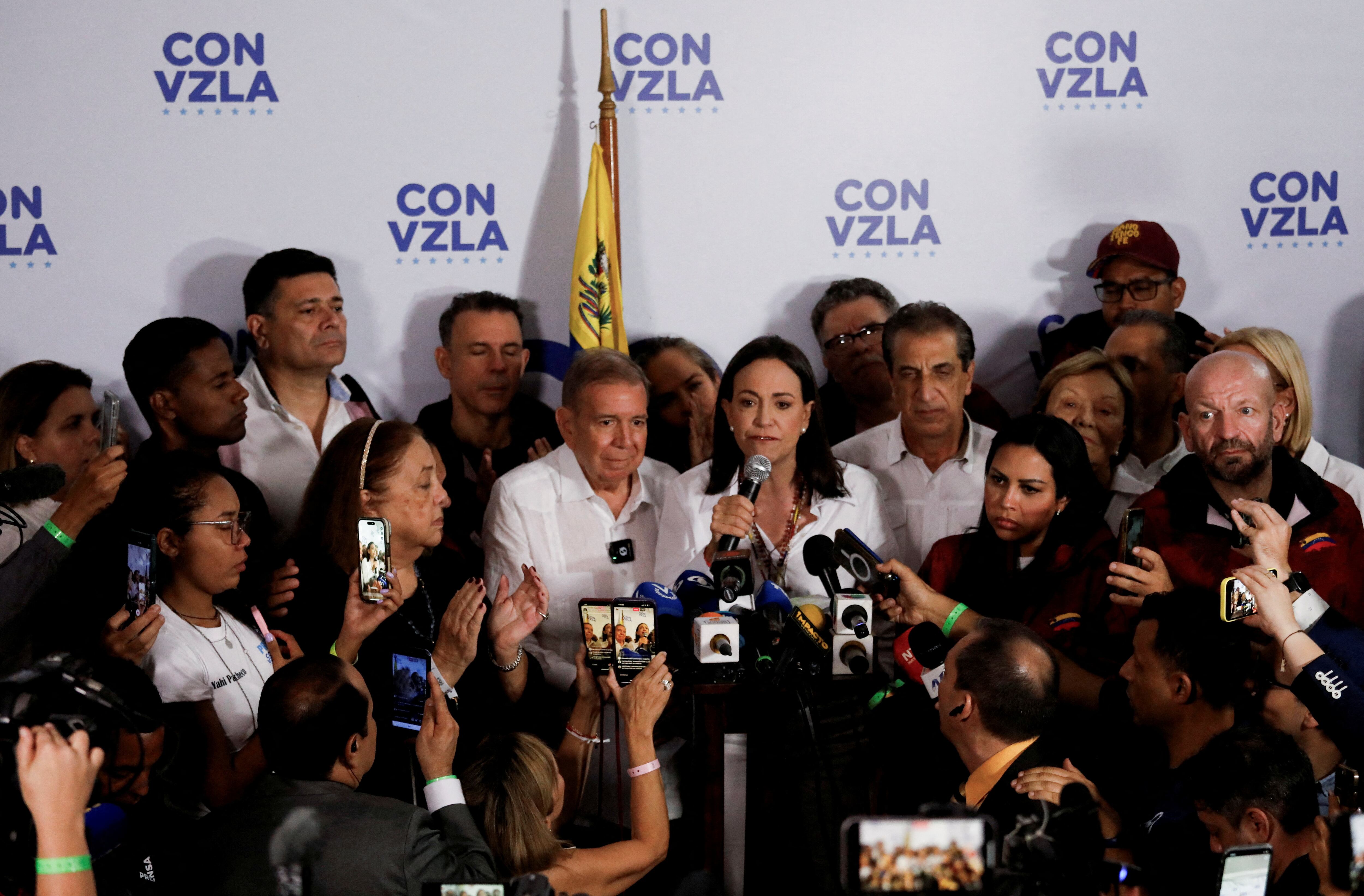 Venezuelan opposition leader Maria Corina Machado addresses the media next to opposition presidential candidate Edmundo Gonzalez after the electoral authority announced that Venezuelan President Nicolas Maduro has won a third term, during the presidential election, in Caracas, Venezuela July 29, 2024. REUTERS/Leonardo Fernandez Viloria  REFILE - QUALITY REPEAT